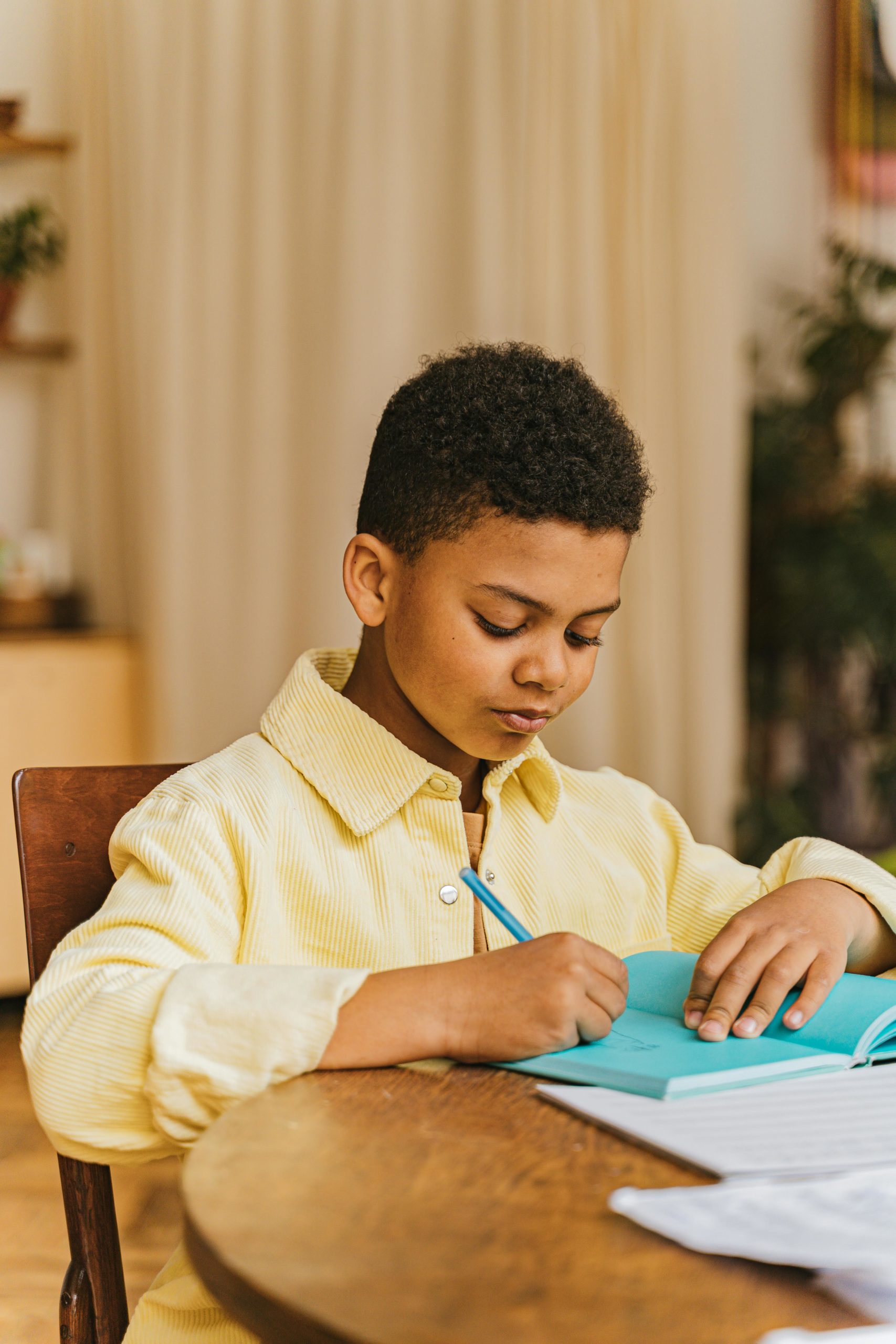 pexels-shkrabaanthony-7970145 boy writing